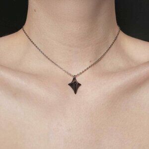 Gothic black spiky star necklace with a small silver chain